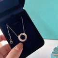 TIFFANY DIAMOND AND MOTHER OF PEARL CIRCLE PENDANT