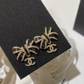 Chanel Crystals Black Enamel Bow Gold Earrings
